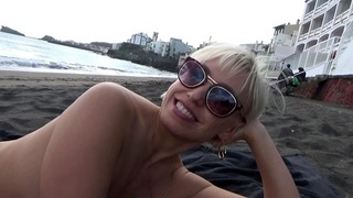 Horny blonde hot masturbates on a public beach