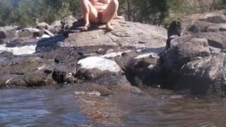 Nude Outdoor Swimming And Lounging On Rocks Others Around