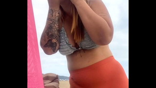 I'm at the beach and I'm already swollen and wet, ready to get fucked