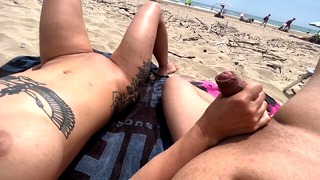 Nudist couple fingering on public beach
