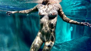 Hot teen with small saggy tits swims nude in a public pool and touches a small dick