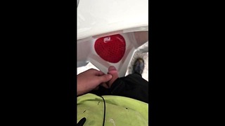 Small uncut penis using a urinal in a public restroom