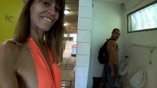 MILF in the public restrooms of a rest area is looking for a daddy to cum in her hot pussy