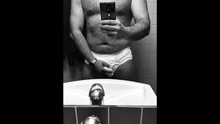 Hot guy in tighty whities pulls out his big soft cock in the office restroom